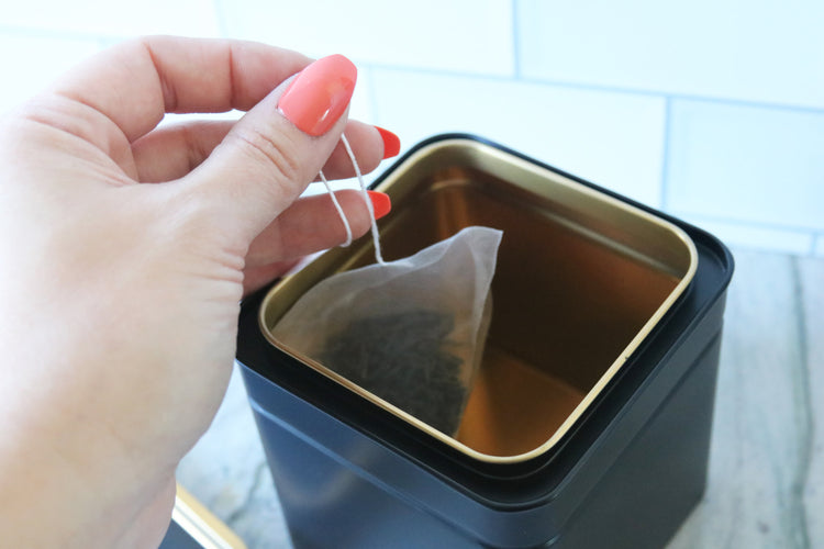 calligraphy black tea or coffee tin canister