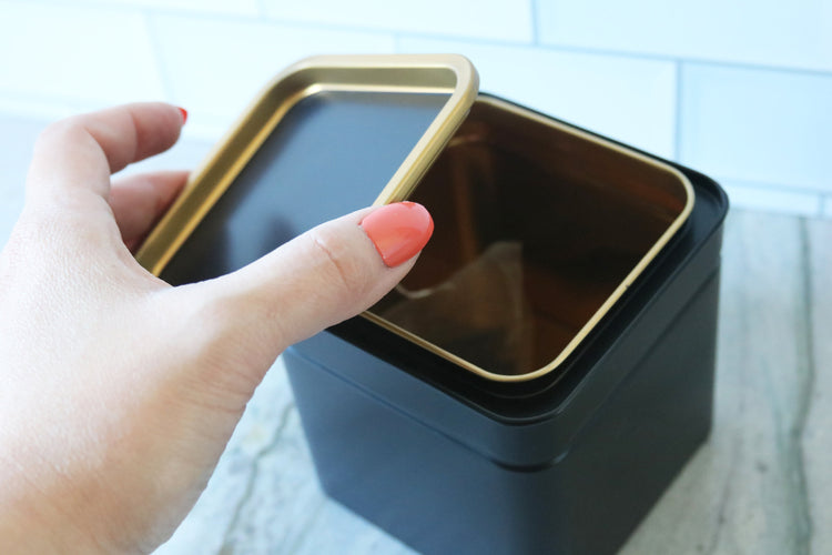 calligraphy black tea or coffee tin canister