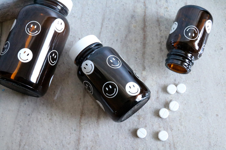 smiley face amber glass pill bottle | stash jar