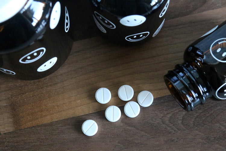 smiley face amber glass pill bottle | stash jar