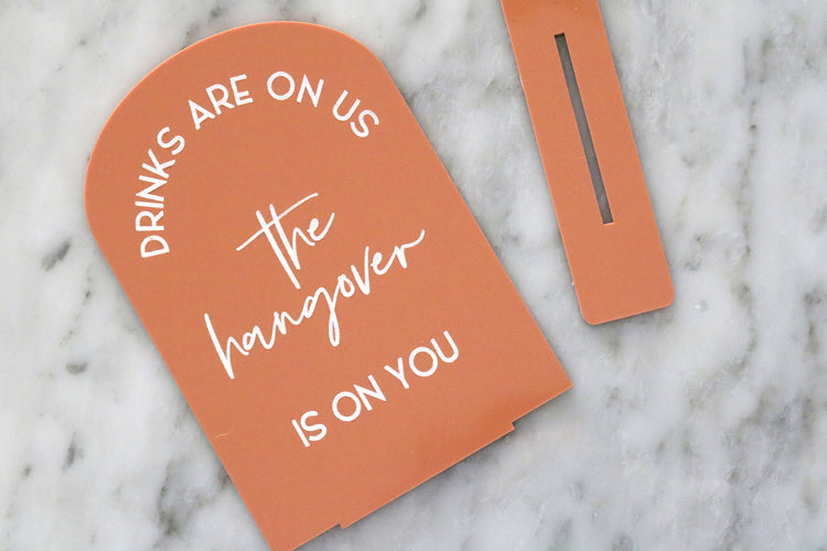 acrylic drinks are on us hangover bar sign | acrylic wedding sign | wedding decor | signature drinks | reception | bar table | bar | alcohol