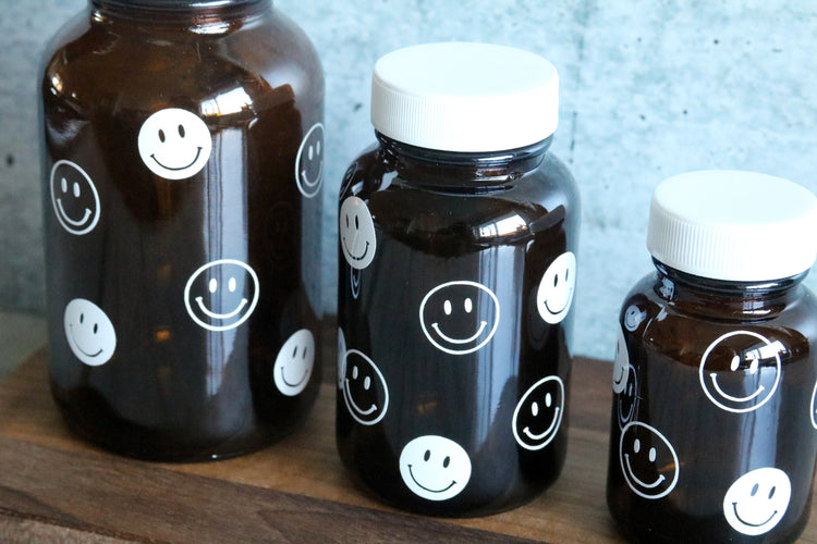 smiley face amber glass pill bottle | stash jar