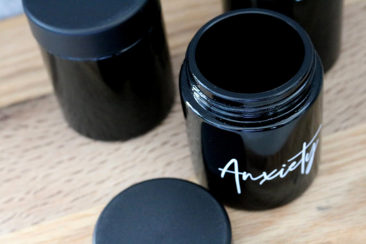 custom labeled black glass stash jar