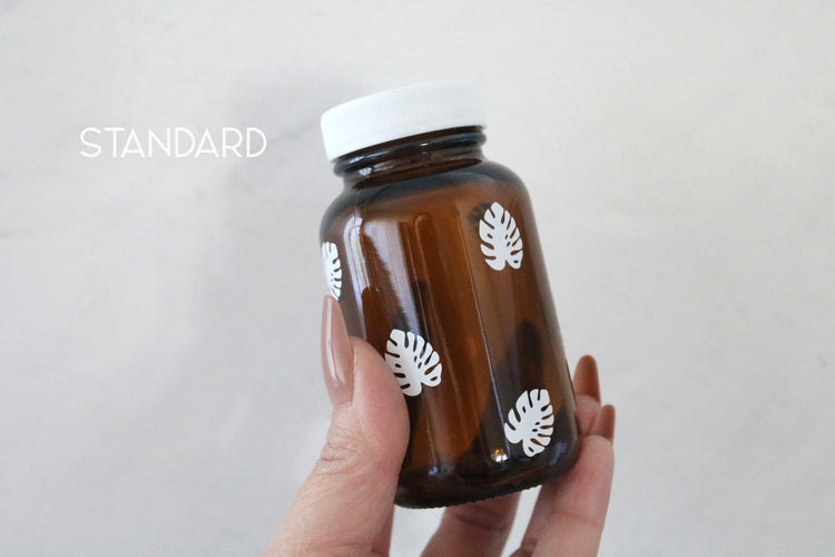 monstera leaf amber glass pill bottle